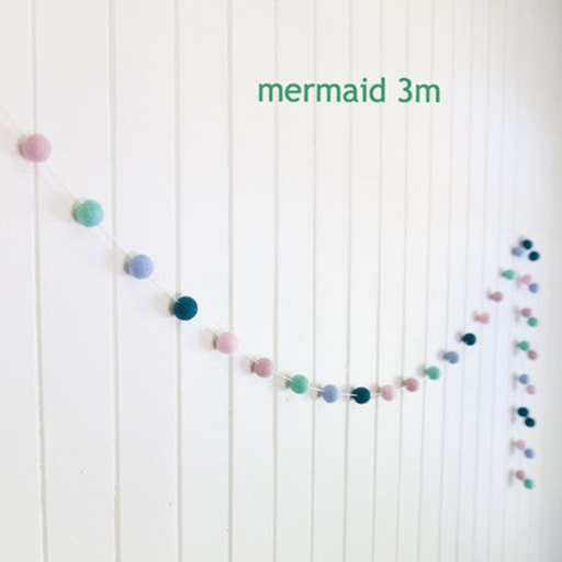 felt garland of round balls, colour mermaid, shades of pale pink, pale teal, pale blue, dark teal, pale coral